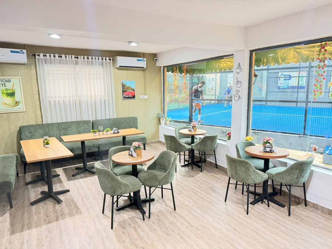Seating area of US Coffee Shop overlooking the tennis court